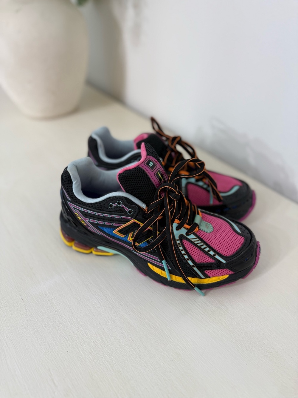 New Balance Pink and Black Kids Athletic Shoes with Multicolor Accents